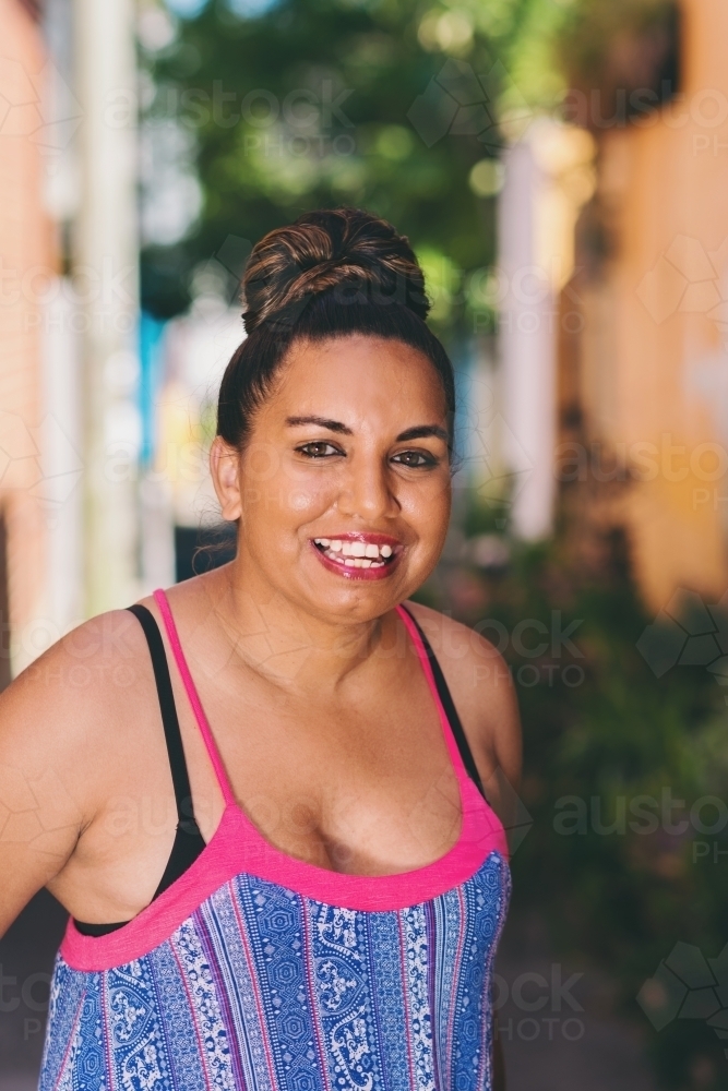 aussie aboriginal woman, smiling to camera - Australian Stock Image