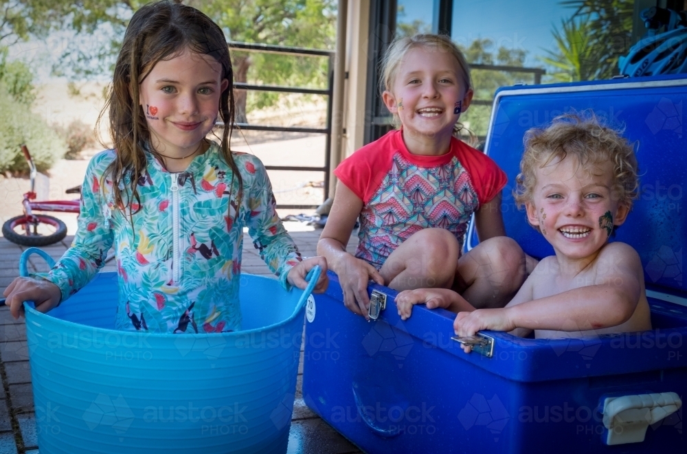 Australia day celebrations with three children in esky's - Australian Stock Image