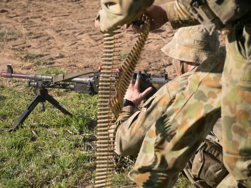 Australian Army Reserve Exercise - Soldier Lying with Gun and Bullets - Australian Stock Image