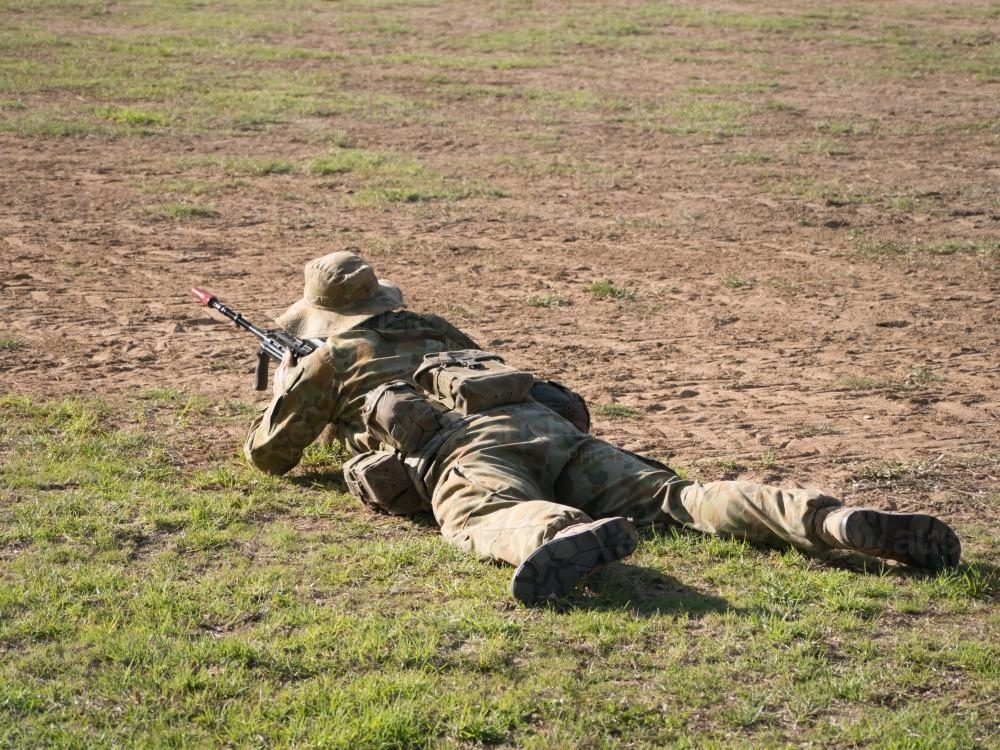 Australian Army Reserve Exercise - Soldier Lying with Gun - Australian Stock Image