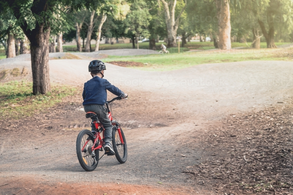 Australian boy riding his bicycle on bike track in Adelaide, South Australia - Australian Stock Image