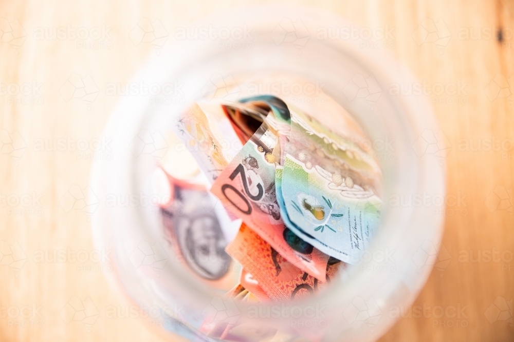 Australian cash money in a jar - Australian Stock Image