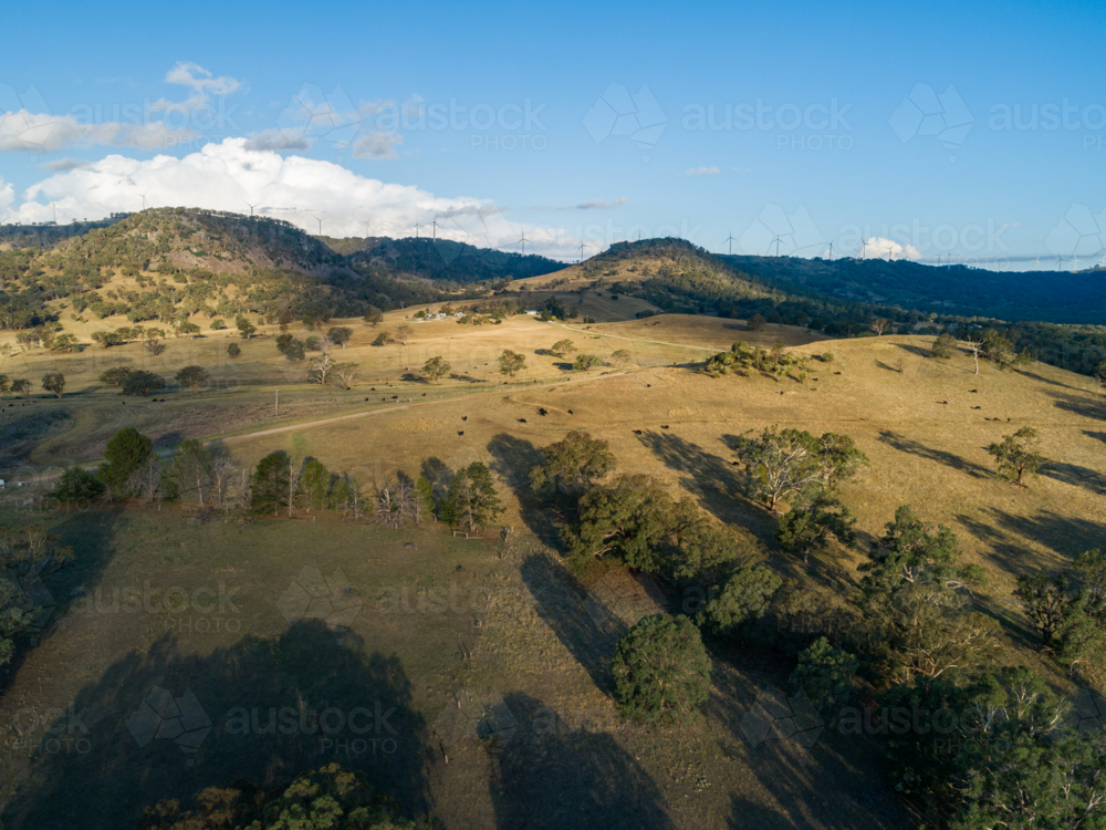 Australian countryside landscape view with wind turbines on horizon in Northern Tablelands - Australian Stock Image