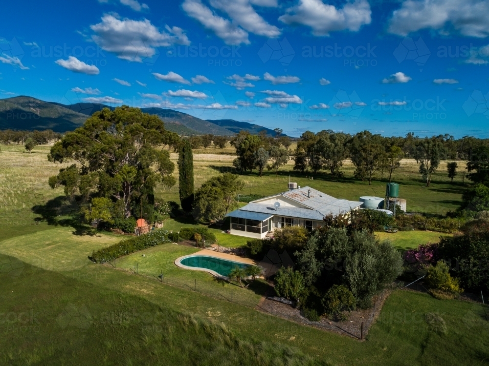 Australian farm home among the gum trees with inground swimming pool - Australian Stock Image