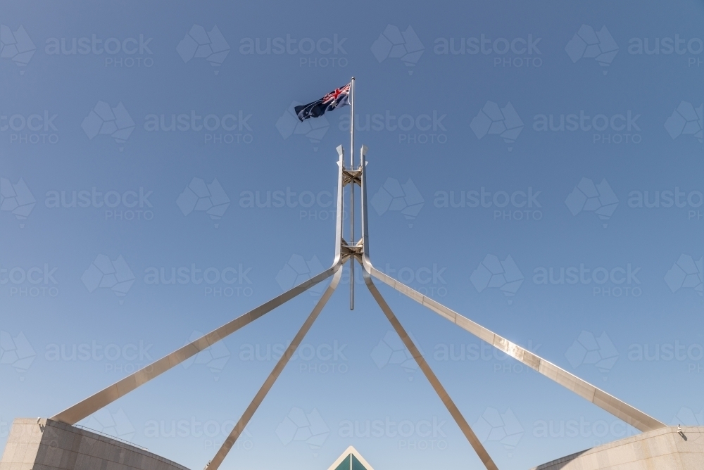 Image of Australian flag above parliament House, Canberra Austockphoto