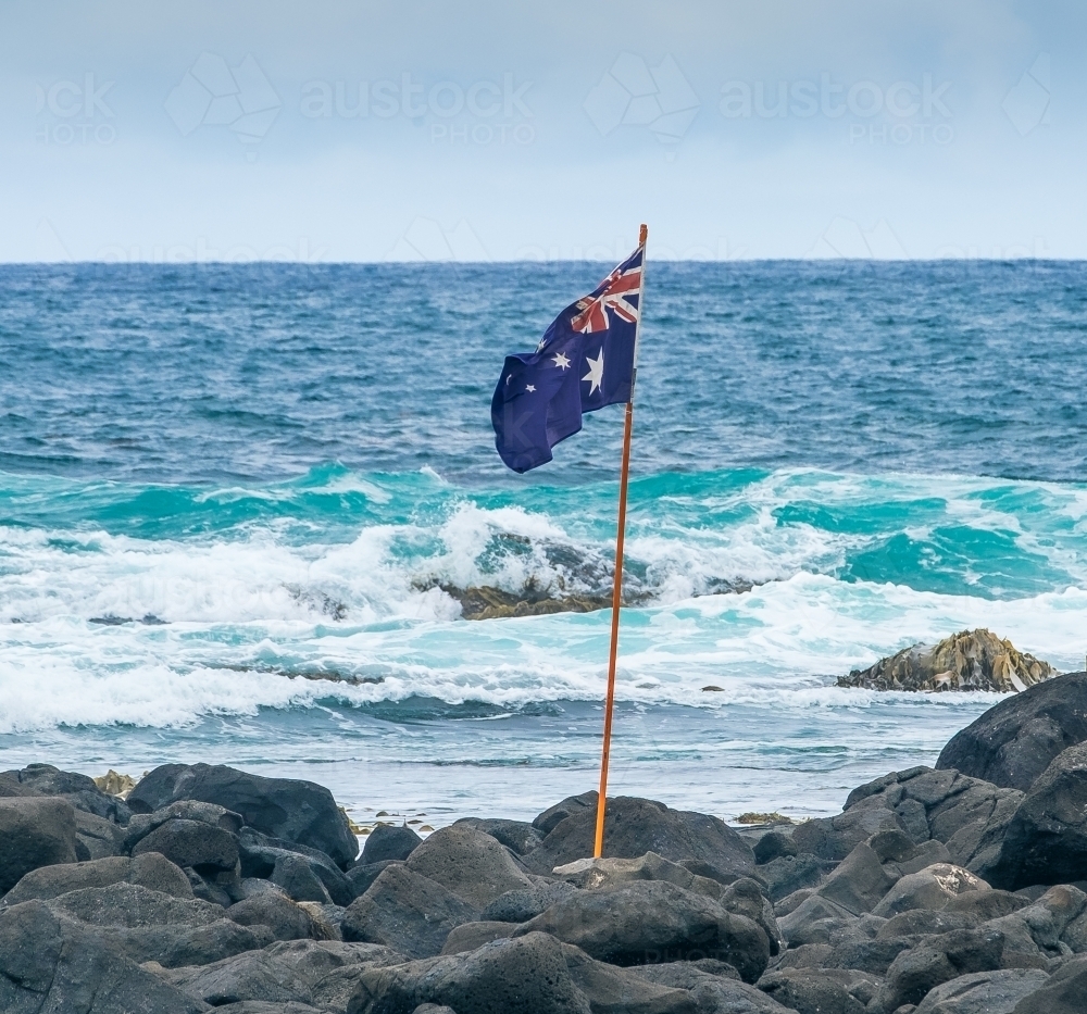 Image of Australian flag beside the sea on Australia day Image of Australian flag beside the sea on Australia day