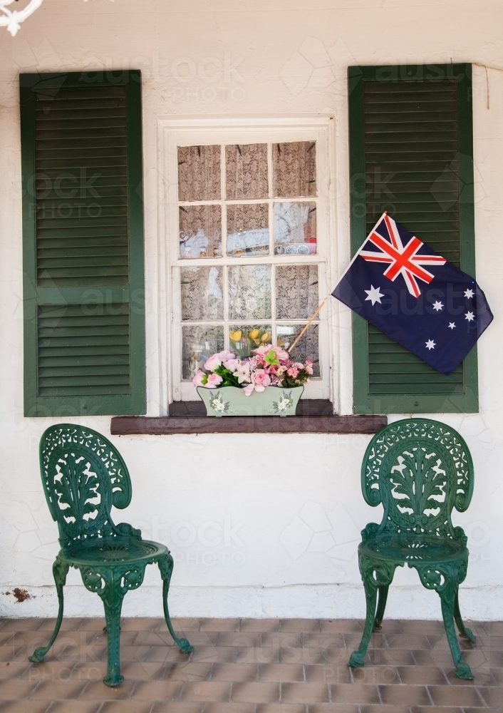 Australian flag in window box flowers on shop front - Australian Stock Image