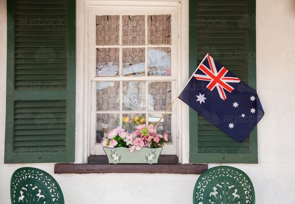 Australian flag in window box flowers on shop front - Australian Stock Image