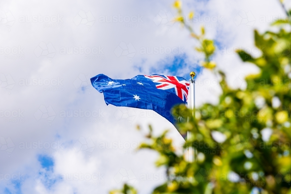Australian Flag on a Flag Pole flying in the Wind - Australian Stock Image