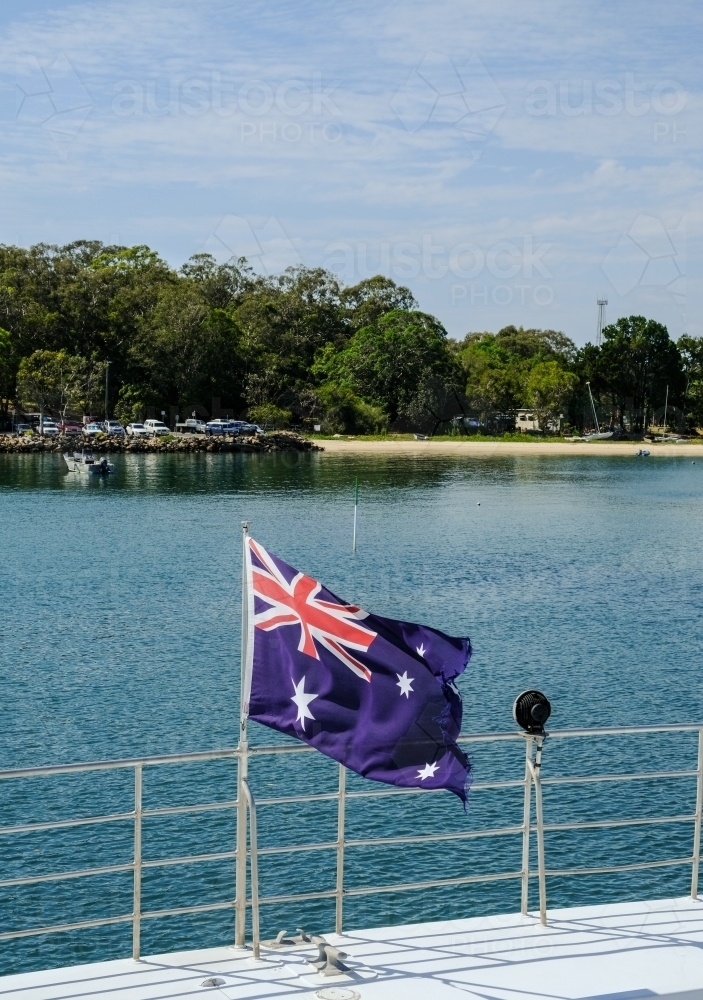 Australian flag on boat arriving at Dunwich - Australian Stock Image