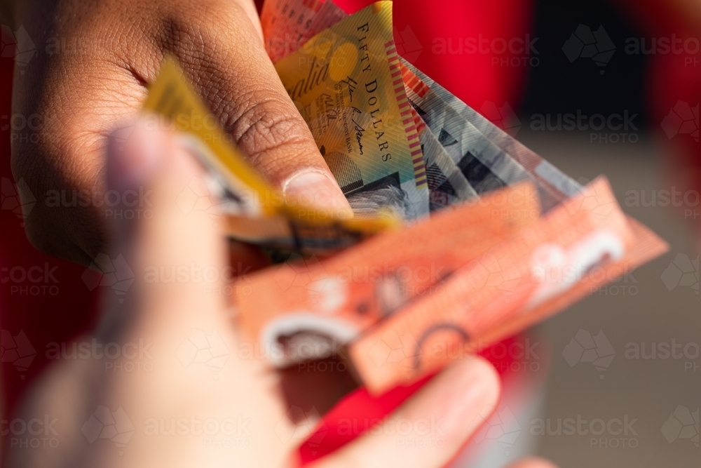 Australian money changing hands - Australian Stock Image
