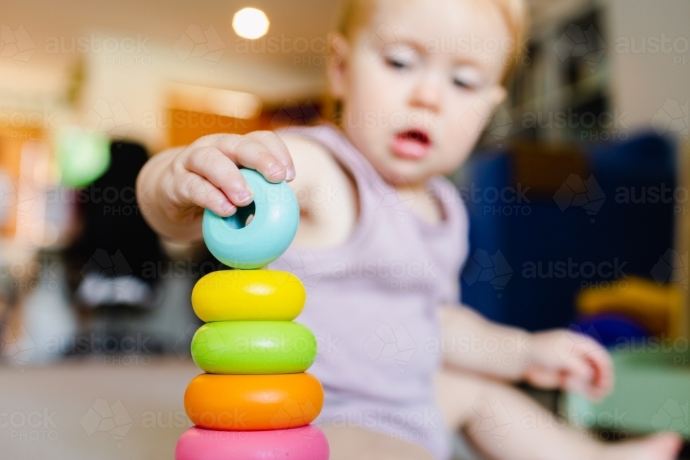 Image of Baby learning through play developing fine motor skills with