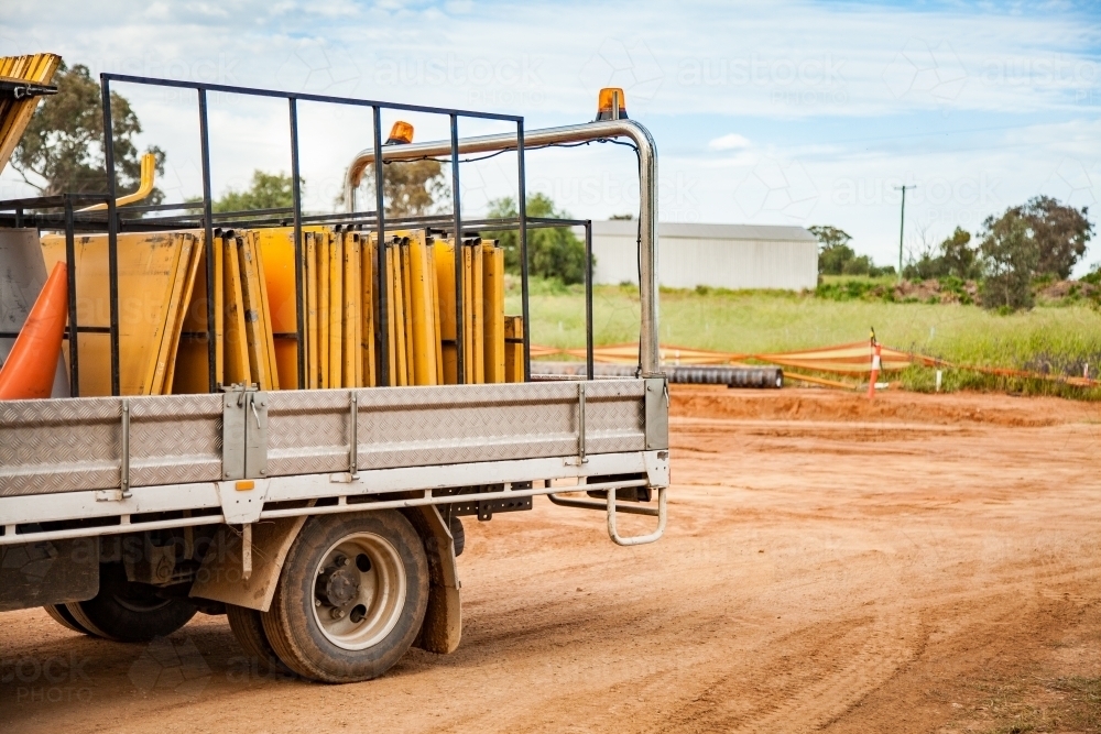 Back of a truck full of roadwork signs on a construction site - Australian Stock Image