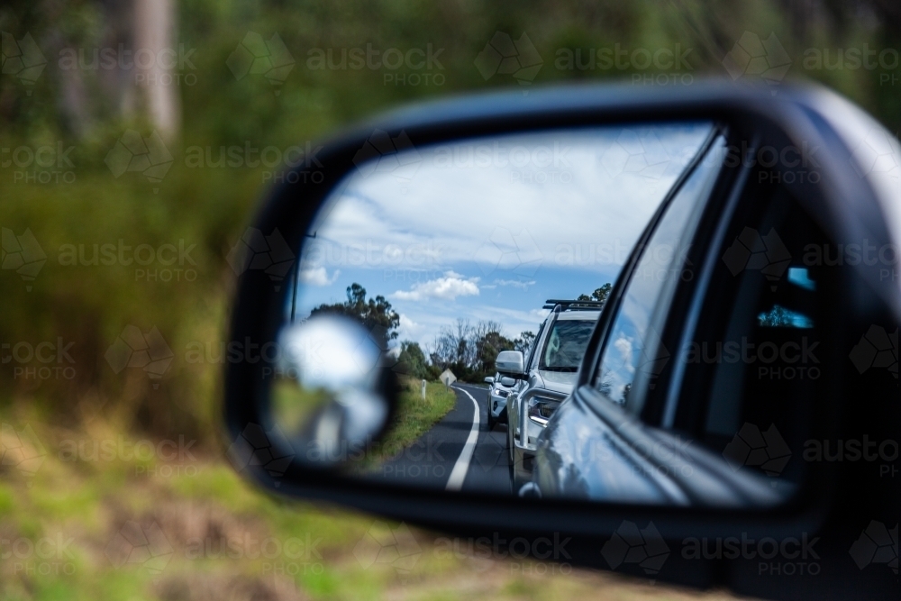 Backed up traffic in car side mirror - Australian Stock Image
