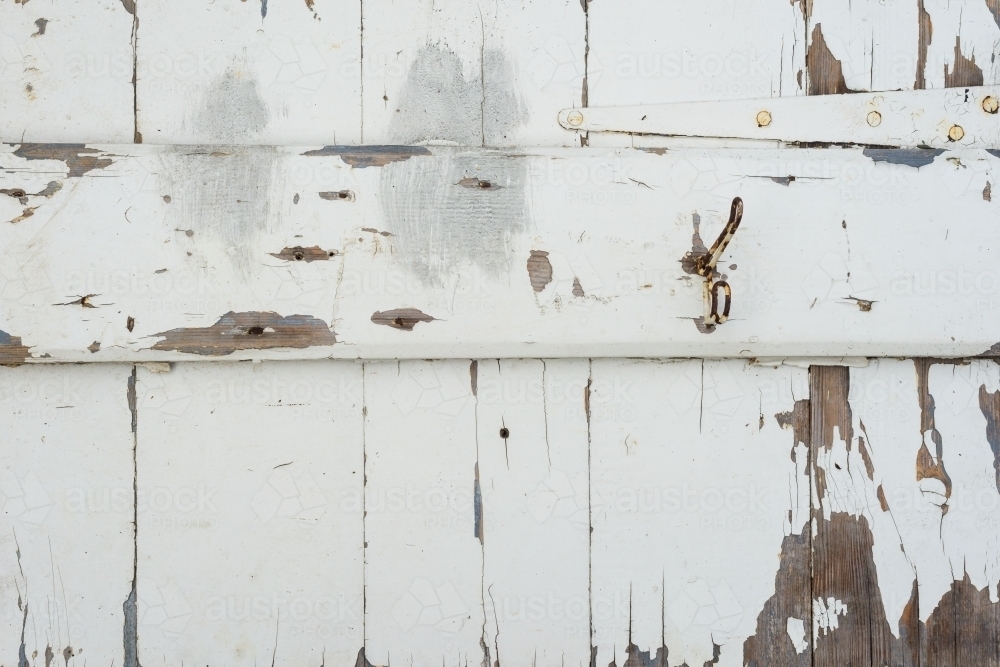 background of a timber door with peeling paint - Australian Stock Image
