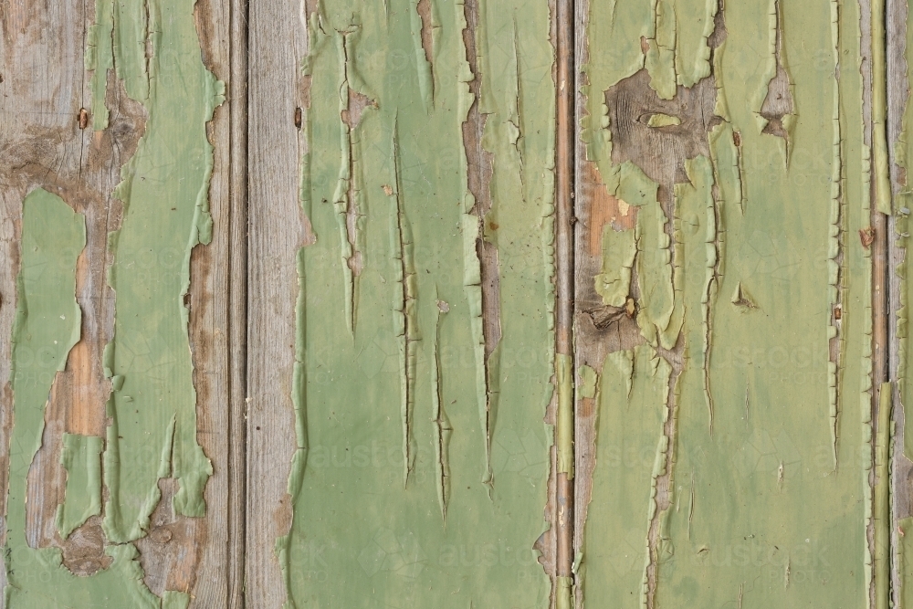 background of green paint peeling off a timber shelf - Australian Stock Image