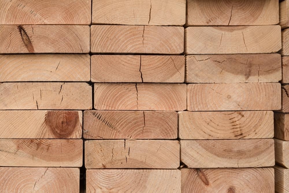 Background of stacked timber plank ends - Australian Stock Image