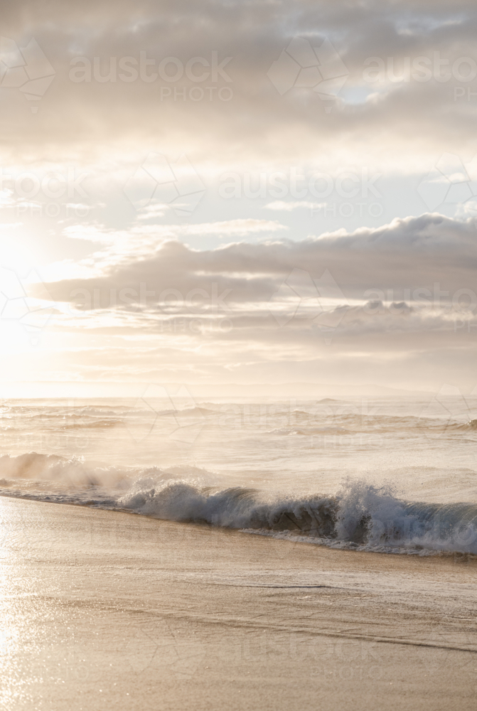 backlit sunrise waves : Austockphoto backlit sunrise waves - Australian Stock Image