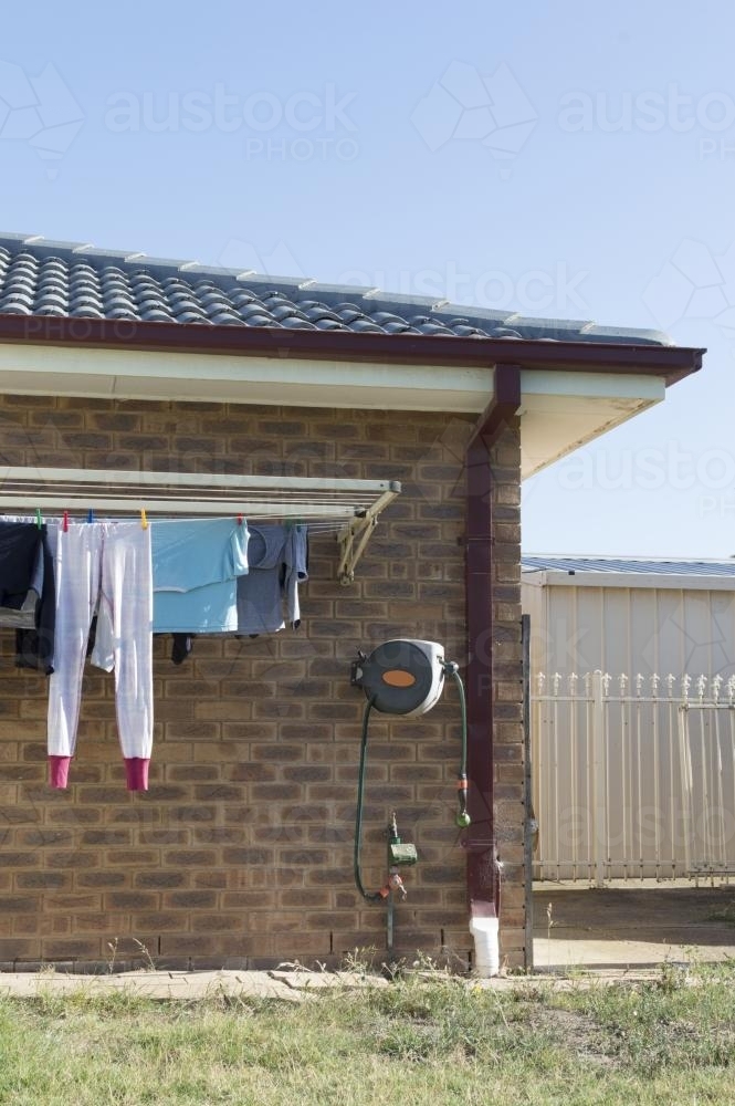 Backyard Washing Line Filled with Clothes - Australian Stock Image