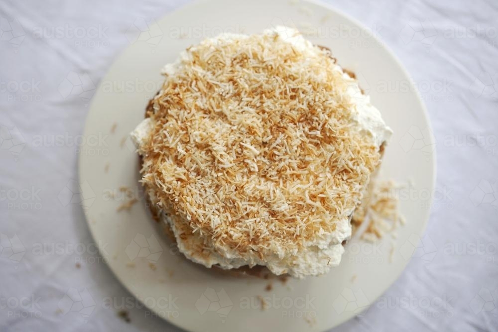Banana cake with coconut on top - Australian Stock Image