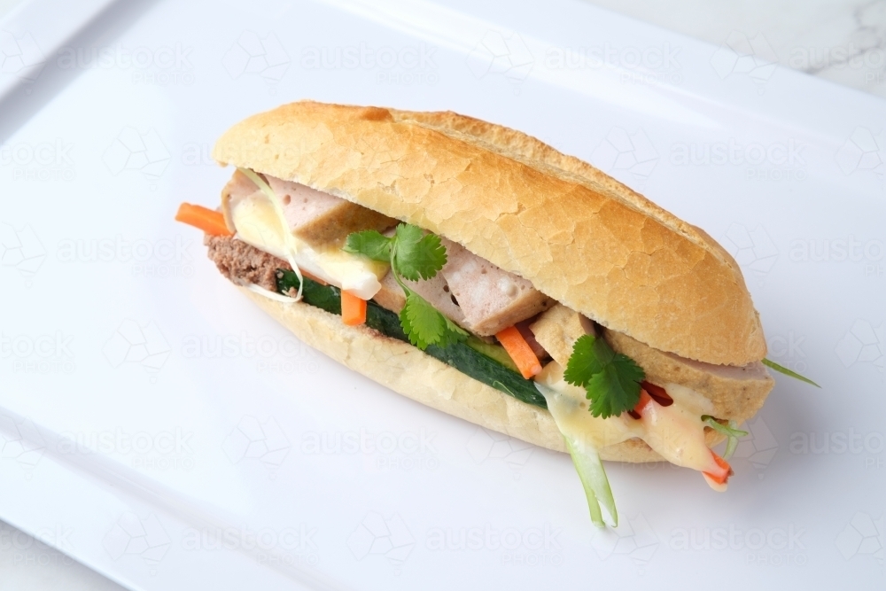 Banh mi on white plastic tray - Australian Stock Image