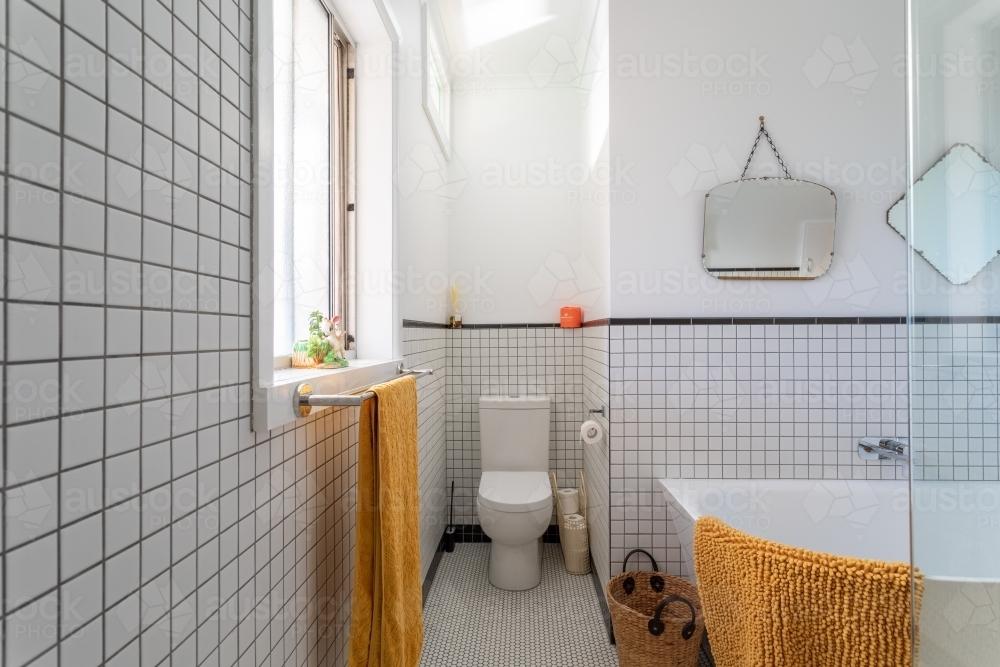 Bathroom renovation featuring toilet and bath - Australian Stock Image