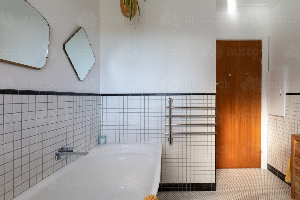 Bathroom renovation with vintage mirrors above bath - Australian Stock Image