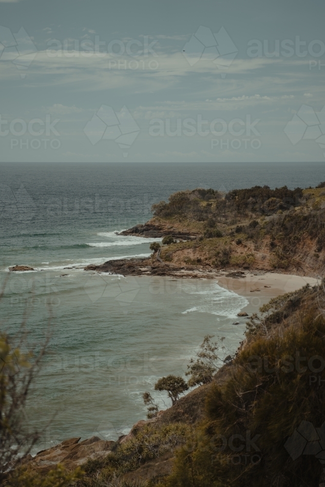 Beach and rocky coastal views near Connor Hurley Point as seen from Razorback Lookout. - Australian Stock Image