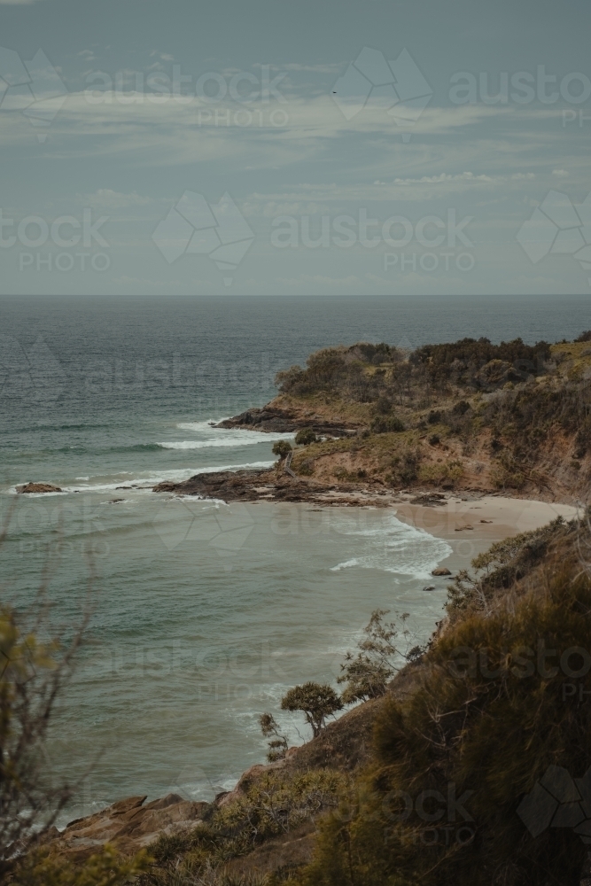 Beach and rocky coastal views near Connor Hurley Point as seen from Razorback Lookout. - Australian Stock Image