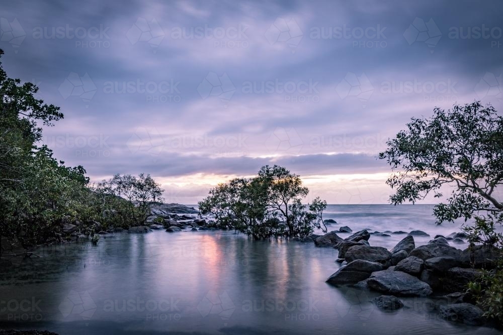 Beach Lagoon with moody sky - Australian Stock Image