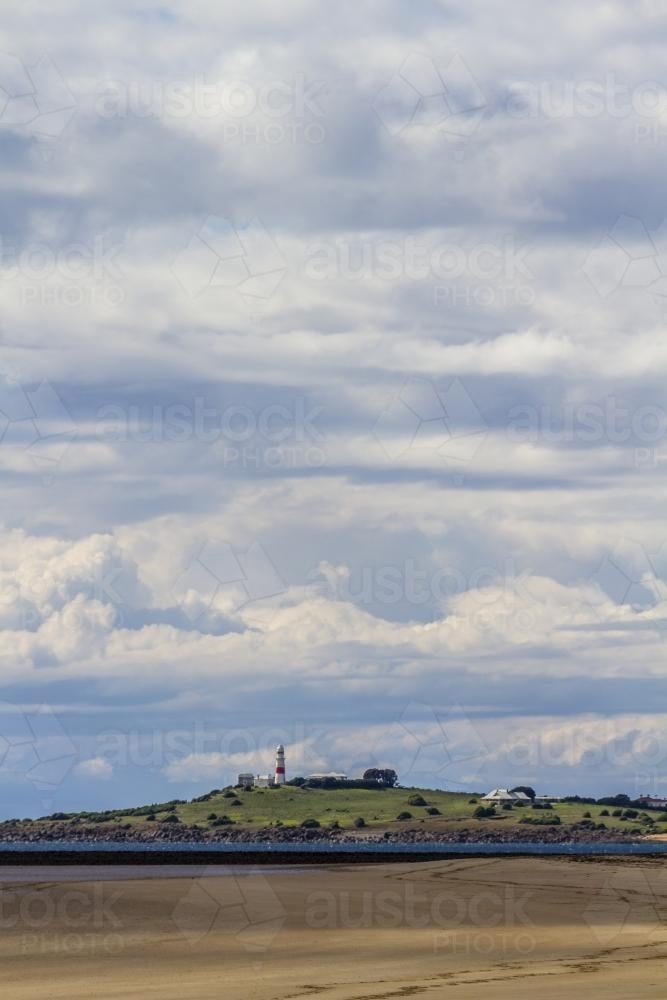 Beach Landscape with Low Head Lighthouse in Distance - Australian Stock Image