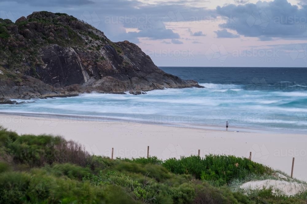 Beach scene with headland and waves - Australian Stock Image
