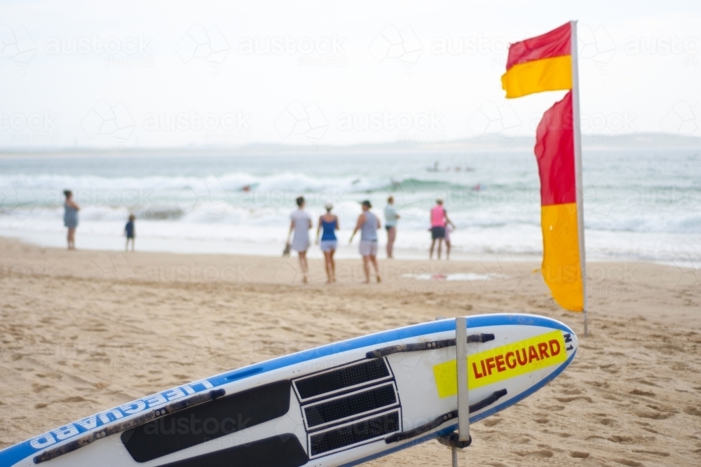 Beach scene with life saving flag and equipment - Australian Stock Image