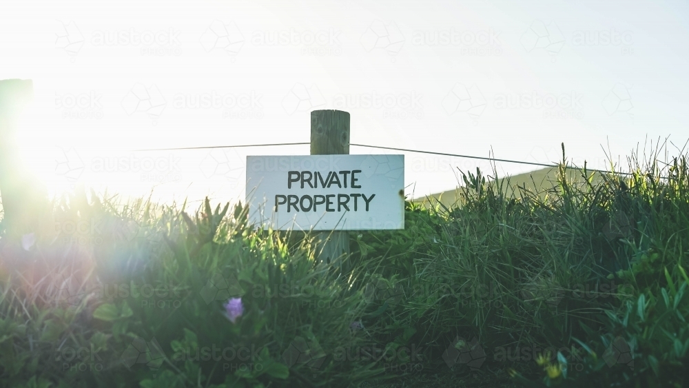 Beach sign with sun glare - Australian Stock Image