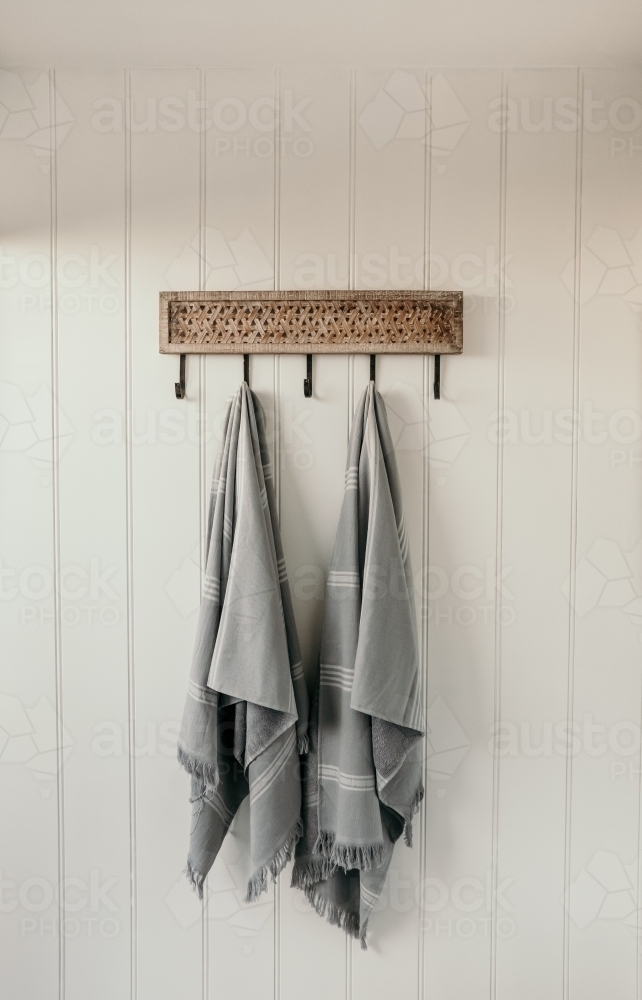Beach towels waiting on a hook. - Australian Stock Image