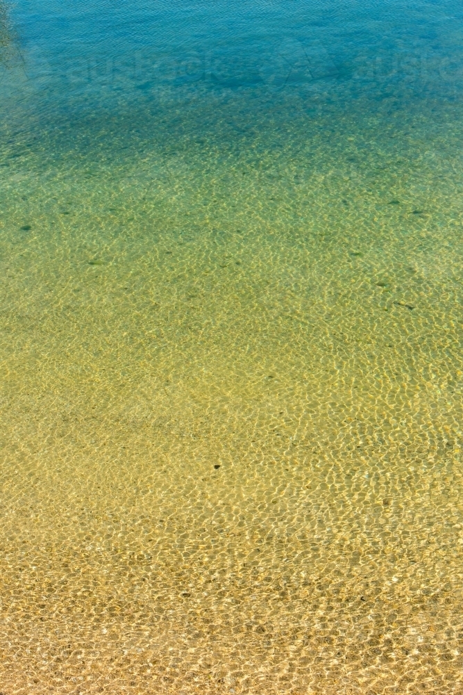 Beach water ripples and sand - Australian Stock Image