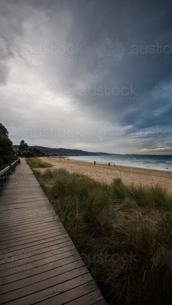 Beachside Boardwalk under a Stormy Sky - Australian Stock Image