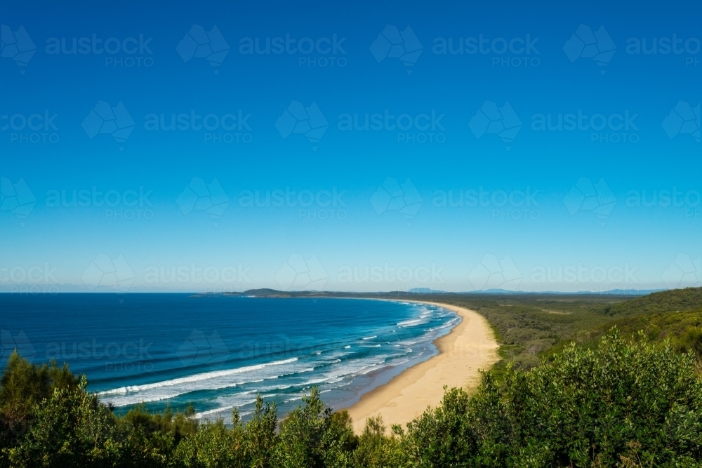 beautiful coastline of NSW, with blue skies and rolling surf - Australian Stock Image