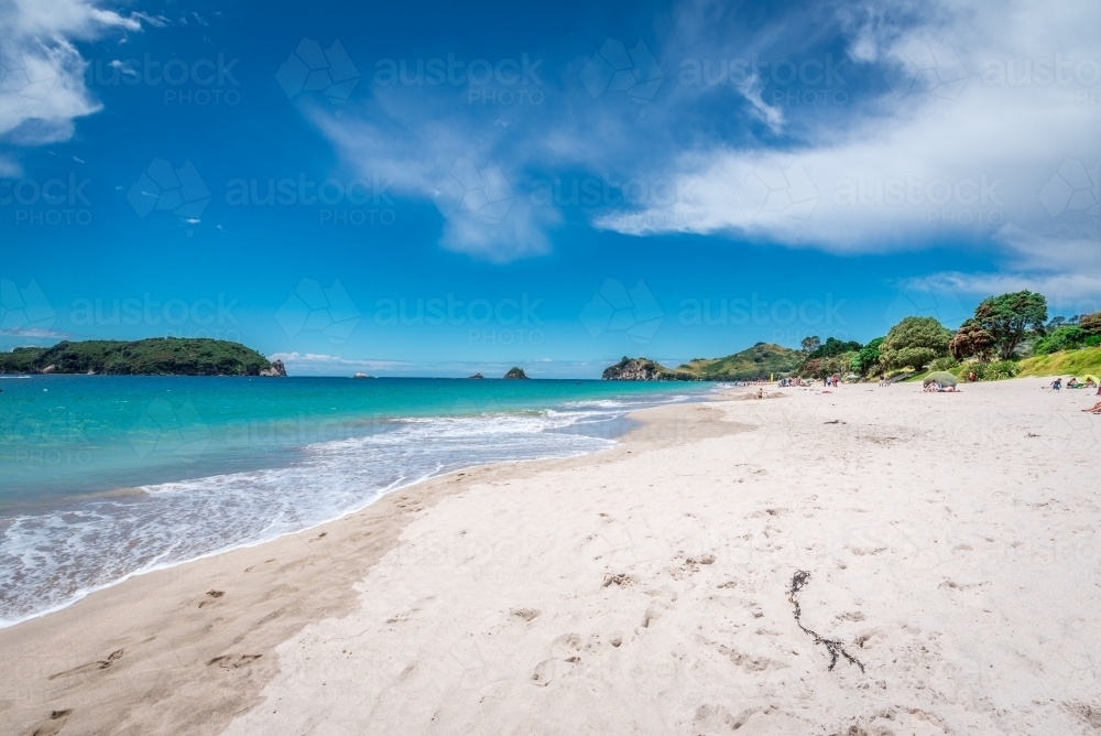 Beautiful white sandy beach with blue sky and white clouds - Australian Stock Image