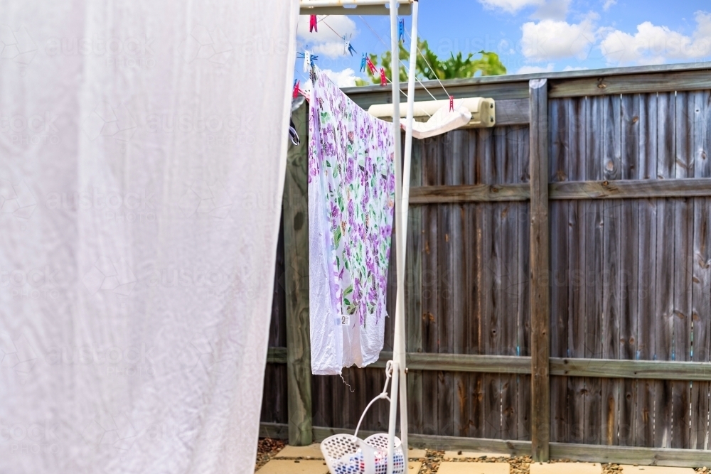 Bed sheets and washing hanging on the line in the hot Australian sun to dry - Australian Stock Image