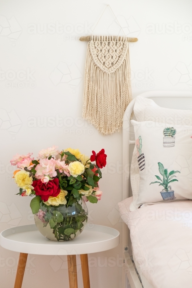 Bedroom with beautiful fresh roses - Australian Stock Image