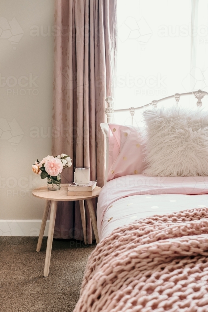 Bedroom with beautiful fresh roses. - Australian Stock Image