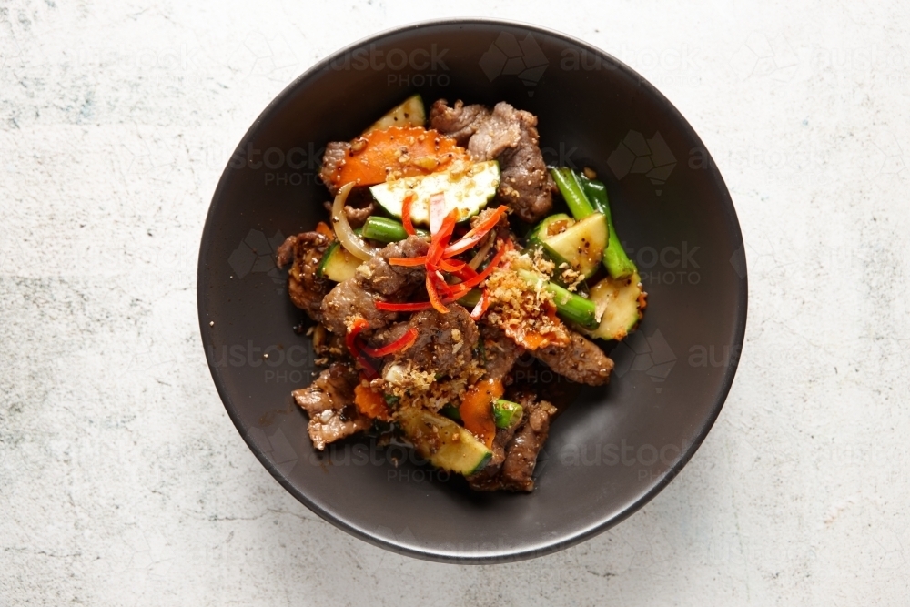 Beef stir fry on table - Australian Stock Image