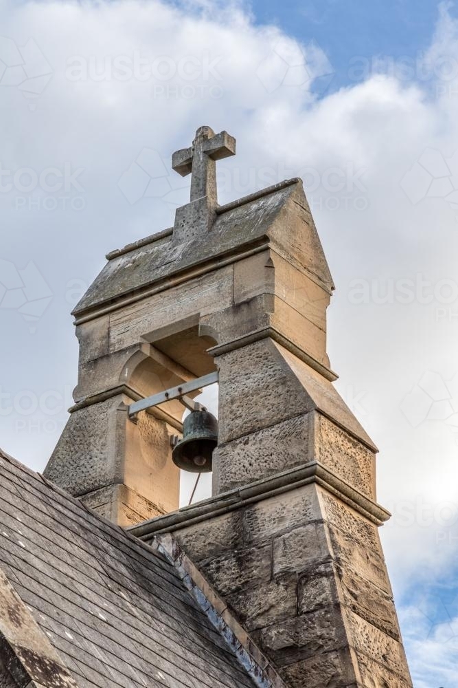 Bell and cross on top of church - Australian Stock Image