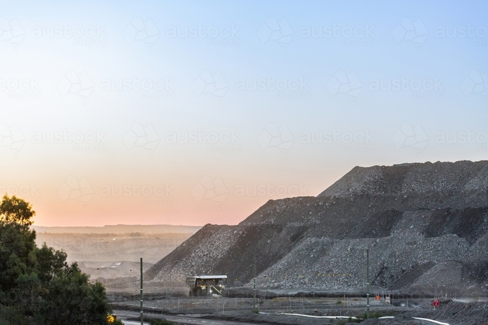 Image of Big machinery working in open cut coal mine at the end of the ...