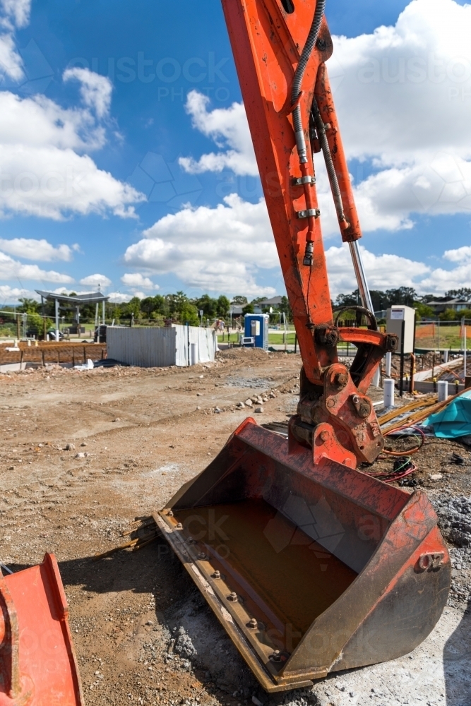 Big orange digger, scraper at a new construction development site - Australian Stock Image
