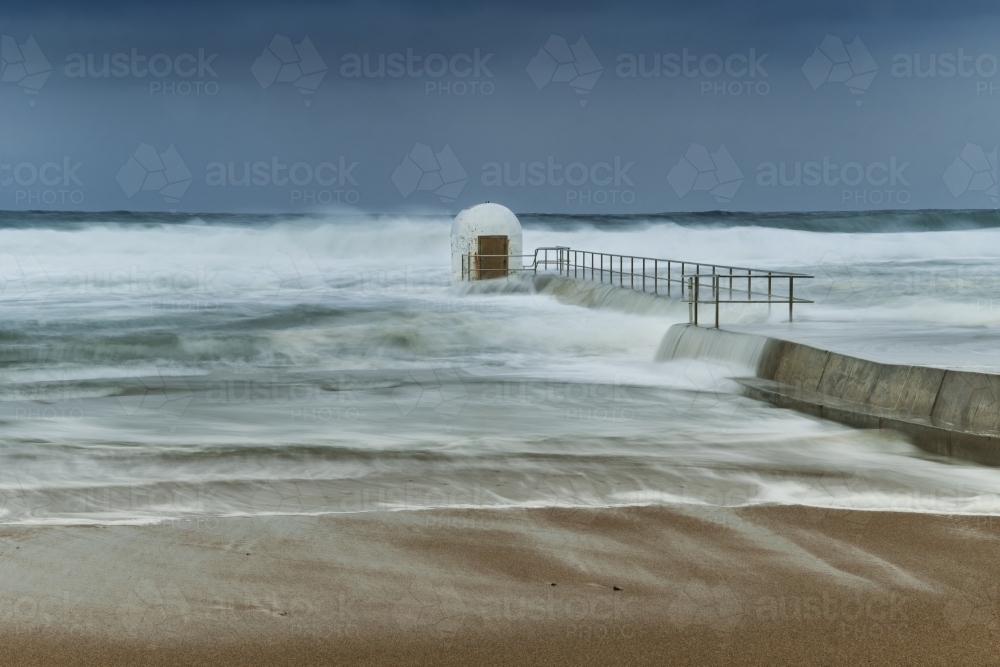 Big swell at Merewether Ocean Baths - Australian Stock Image