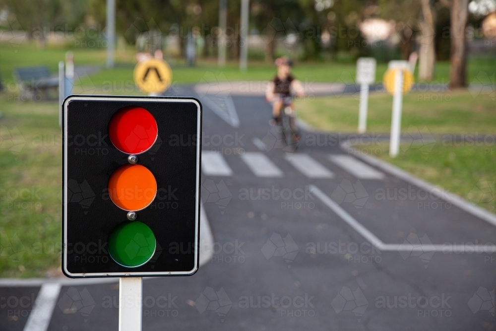 Image of bike path with road markings and traffic lights in a public ...