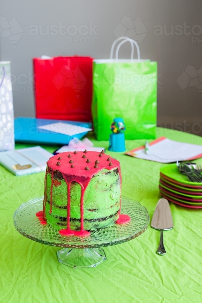 birthday party with cake and presents on a table - Australian Stock Image