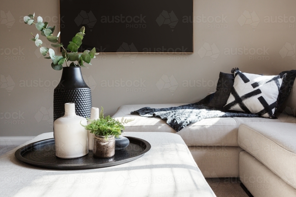 Black accent decor in a luxury family living room - Australian Stock Image